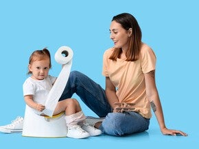 Child holding tissue with her mom