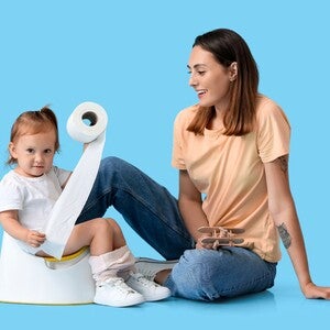 Child holding tissue with her mom