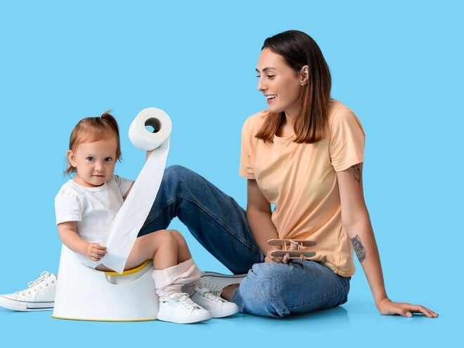 Child holding tissue with her mom
